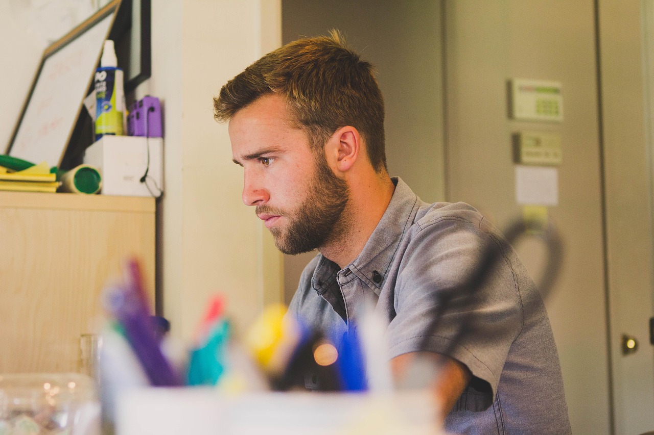 Man, work, desk — Capturing the Moment: Selfie Caption Ideas for Every Situation