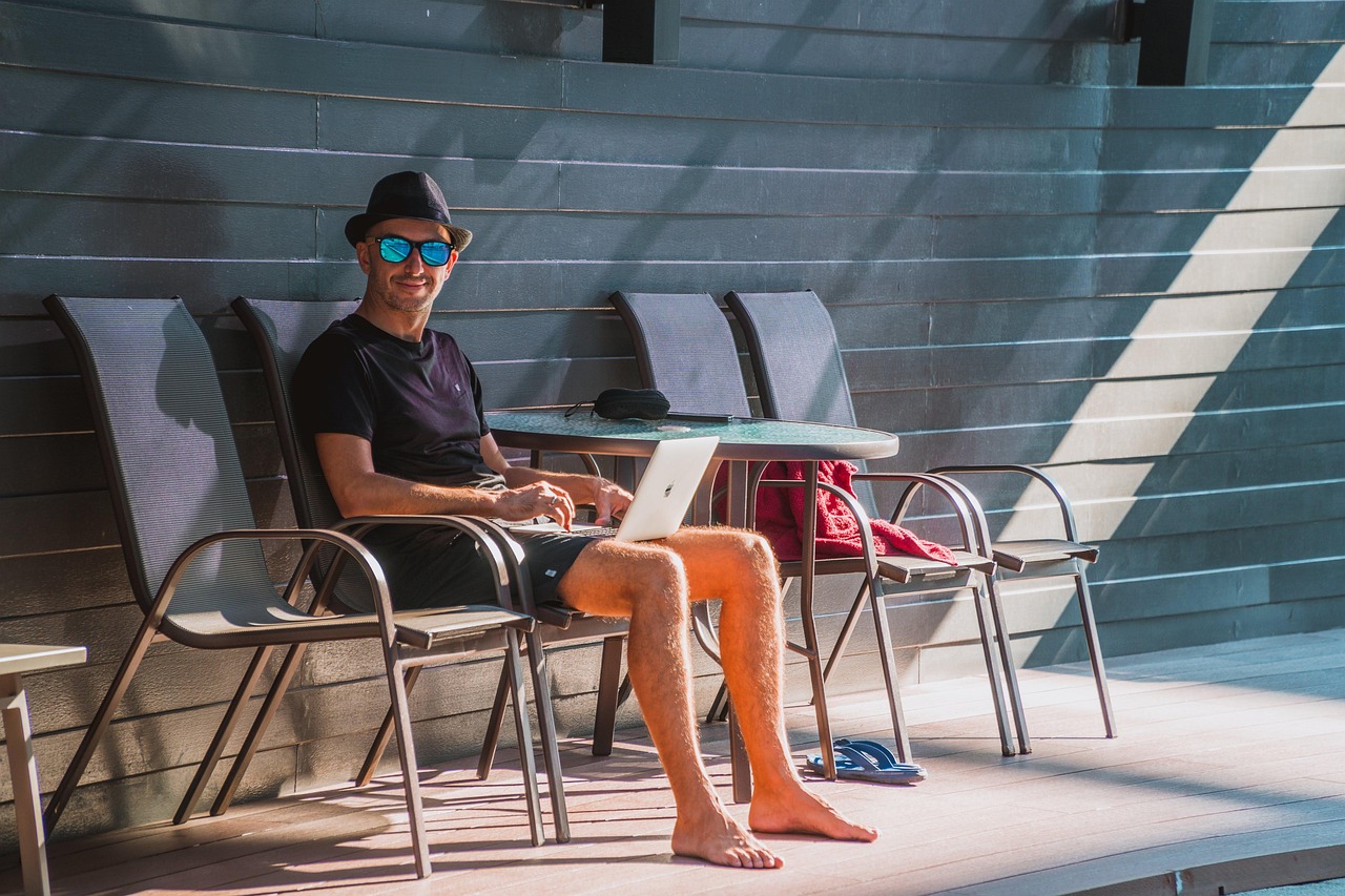 Man, laptop, work — How to Learn Poker Without Spending a Dime
